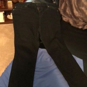 A pair of dark skinny jeans